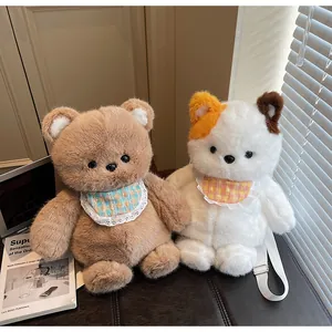 Detail of plush bear and cat cross-body bags with lace bibs and adjustable straps