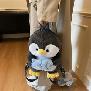 Cute plush penguin backpack featuring a 3D animal design with small blue fish detail