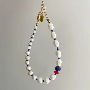 Baroque pearl and blue lapis lazuli beaded bracelet with heart charm and gold clasp