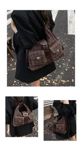 Detail of brown checkered tote bag featuring front flap pockets and metallic buckles