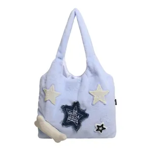 Light blue fuzzy star tote bag with denim patch and plush bone charm for winter