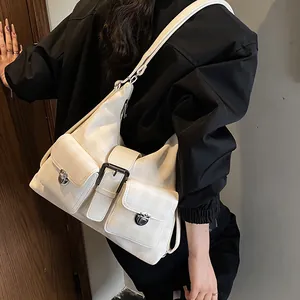 Chic beige checkered hobo bag with front pockets and silver buckles for casual commute