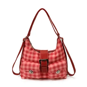 Fashionable red and pink plaid backpack with large capacity and durable silver hardware