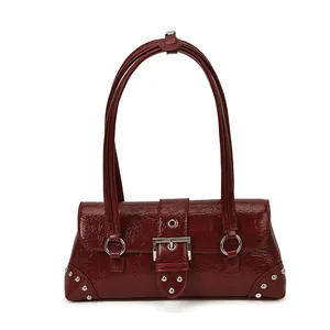 Retro burgundy underarm bag in glossy patent leather with silver buckle and rivets