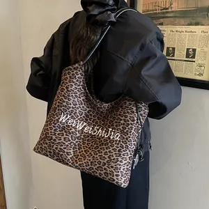 Chic leopard print tote bag with large capacity and stylish black shoulder straps