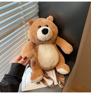 Close-up of soft brown plush bear backpack with adjustable nylon straps and metal buckles