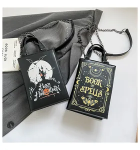 Detail of Halloween book-shaped bags with Spells and moon phase gold-foil patterns
