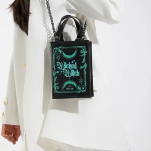Gothic book shaped handbag with Wicked Witch print and black metal chain shoulder strap
