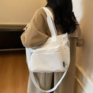 White nylon tote bag with multi-zipper design and large capacity for women