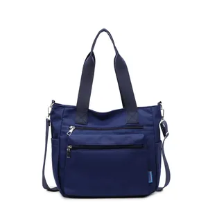 Navy blue nylon tote bag with multiple zippers and large capacity for commuting