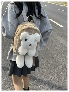 Detail of cute 3D puppy plush backpack in brown and white faux fur with adjustable straps