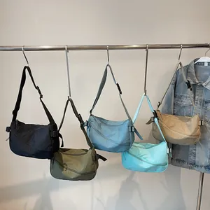 Lightweight nylon crescent crossbody bags in multiple colors with adjustable wide straps