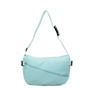 Lightweight mint green nylon crossbody bag with adjustable strap and front zipper pocket