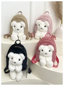 Detail of soft faux fur bear backpacks in pink, brown, black and rose red with gold zippers