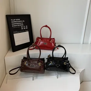 Retro glossy leather handbags in red, brown, and black colors with triangle metal logo