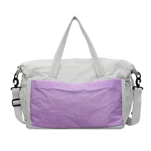 Large capacity grey travel bag with purple plaid pocket and adjustable shoulder strap