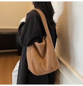 Close-up of caramel teddy fleece tote bag texture with integrated shoulder strap