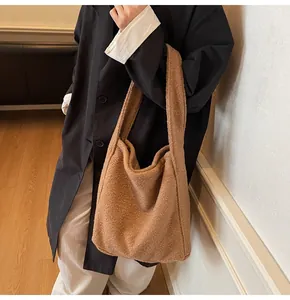 Caramel faux fur tote bag styled with a black trench coat for a chic winter look
