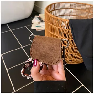 Mini vintage dark brown suede crossbody bag with braided strap and silver metal hardware