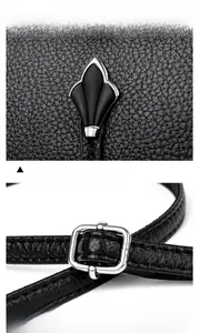 Détail du sac coquille en cuir grainé noir avec boucle argentée et fermoir en métal décoratif