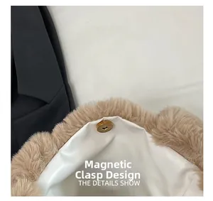 Detail of the magnetic clasp design on a khaki plush handbag with soft white lining