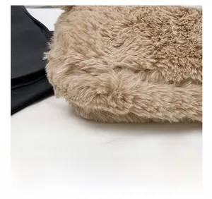 Close-up of soft brown faux fur texture on a plush cartoon tote bag showing material detail
