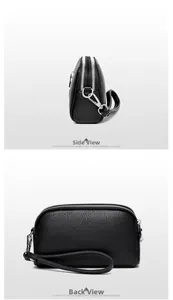 Détail du sac bandoulière en cuir grainé noir avec deux fermetures éclair argentées