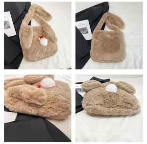 Detail of plush brown bunny tote bag with long soft ears and white pom-pom decoration