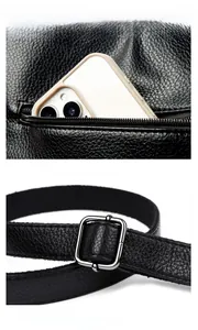 Detail of black pebbled leather tote showing rear zipper pocket and adjustable metal buckle