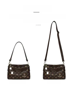 Détail du sac à bandoulière monogramme avec sangle courte et bandoulière longue réglable