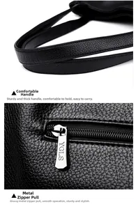 Detailed macro of black pebbled leather texture with silver YGLS branded zipper hardware
