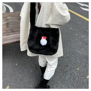 Close-up of black faux fur shoulder bag with white pom-poms and red rabbit tag detail