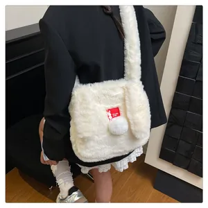 Detail of white plush shoulder bag with cute long rabbit ears and soft fluffy texture