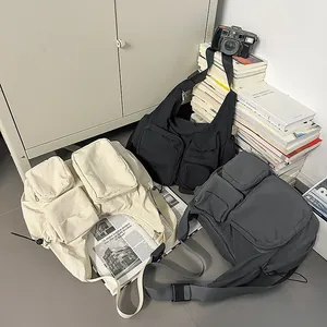 Practical multi-pocket shoulder bag in beige, black and dark grey utility style