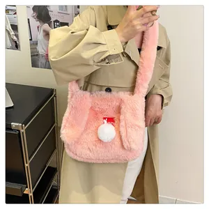 Close-up of pink fluffy plush shoulder bag featuring cute rabbit ears and soft faux fur texture