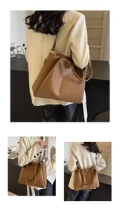 Detail of brown tote bag with lychee texture and bohemian jacquard wide shoulder strap