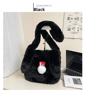 Detail of a black plush handbag featuring rabbit ears design and white pompom tail