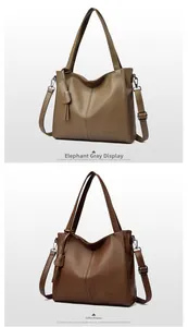 Detail of elephant grey and coffee brown leather bags with lychee grain texture