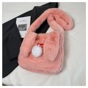 Detail of pink faux fur rabbit shoulder bag showing soft texture and cute ears