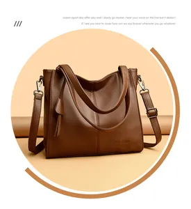Detailed macro view of the dark brown lychee grain leather texture on the tote bag