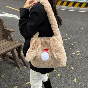 Plush faux fur beige shoulder bag with cute white pompom charm for autumn and winter