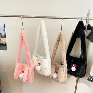 Furry rabbit ear tote bags in pink white beige and black with fluffy pom pom details