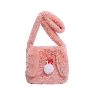 Pink plush rabbit shoulder bag with soft faux fur ears and cute pompom detail