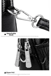 Detail of silver detachable hooks and double metal zippers on black leather shell bag