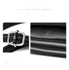 Detail of black litchi grain leather texture with silver metal buckles and zippers