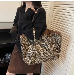 Detailed view of the large leopard print tote bag interior and fabric texture