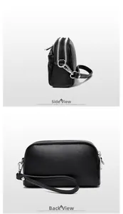 Detail of black lychee leather handbag featuring double silver zippers and metal hooks