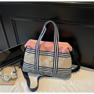 Three-color patchwork travel bag showing large capacity and adjustable shoulder strap