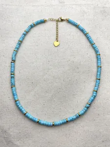 Turquoise beaded necklace with gold heart charm and adjustable extension chain