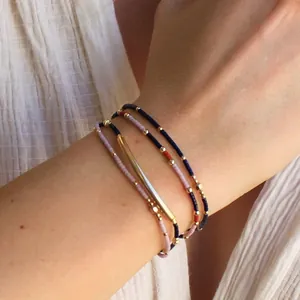 Bohemian multilayer beaded bracelet set with tiny colorful seed beads and gold accents